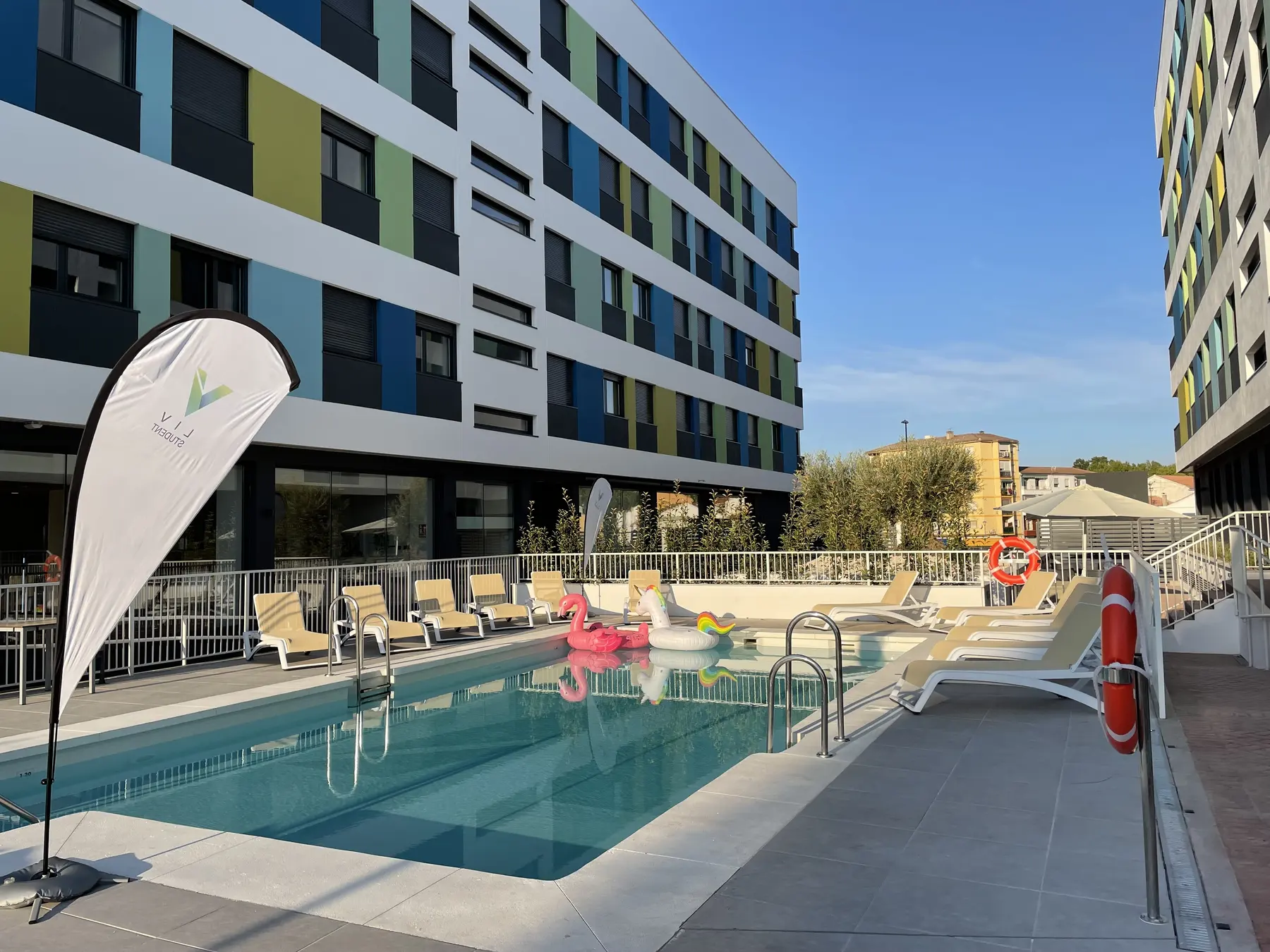 Student residence buildings and an outdoor swimming pool in Granada
